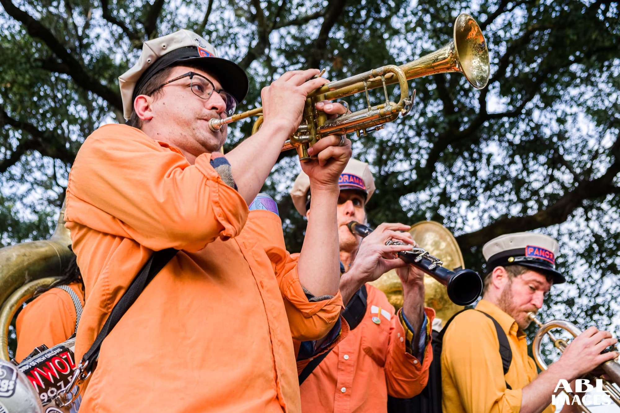 Reid Poole performing trumpet with a brass band outdoors