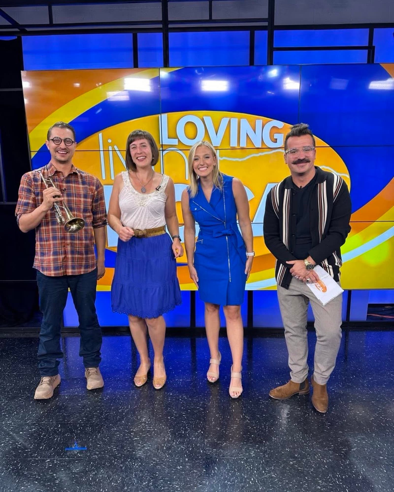 Reid Poole and guests on a television studio set